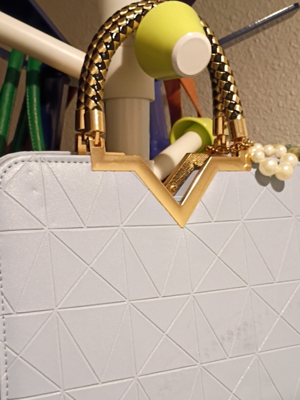 Structured White Satchel with Gold Accents and Braided Handles